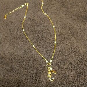 1928 Brand, gold tone and faux pearl, charm necklace